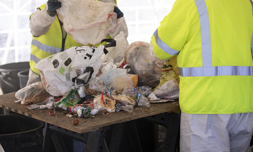 Contractors sort through trash to characterize the waste.